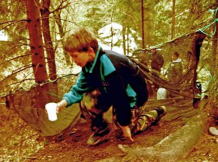 Obstacle course with water filled plastic cup.